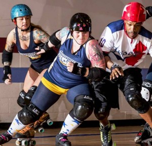 Kitty Klime of Philly Roller Girls (center) hits Jersey boy Rollomite (photo by David A Carter Photography)